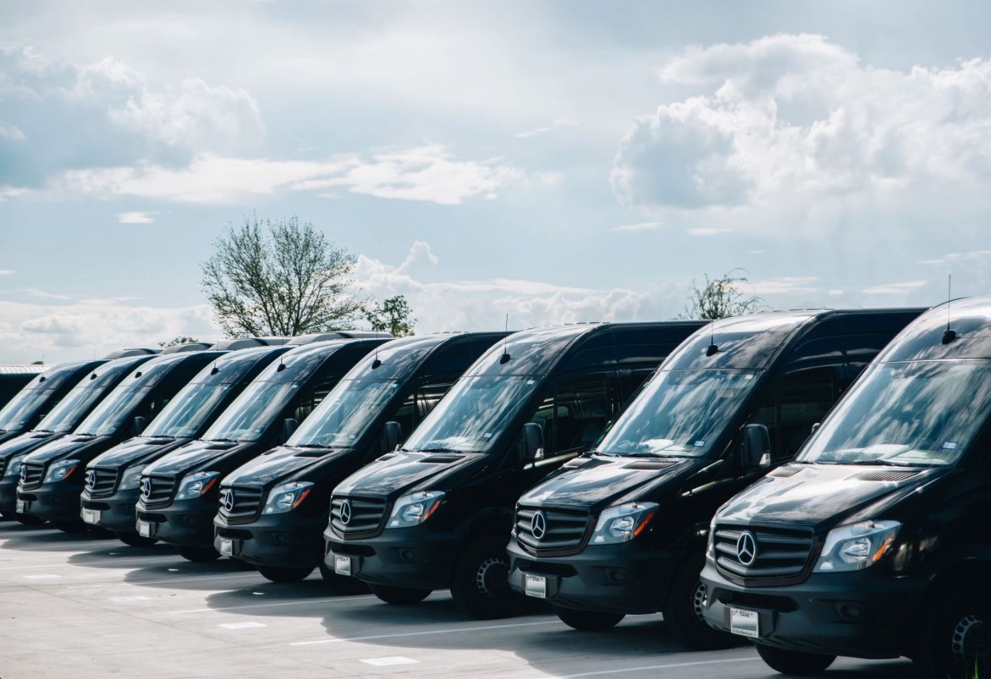 GroundShuttle fleet of black Mercedes Sprinter vans