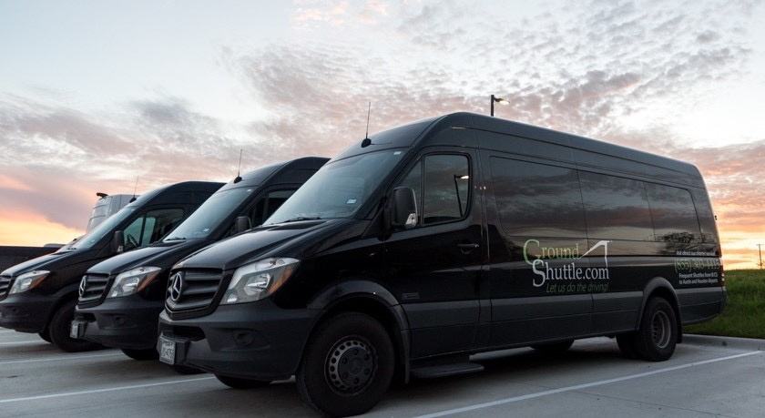 GroundShuttle Sprinter vans at sunset